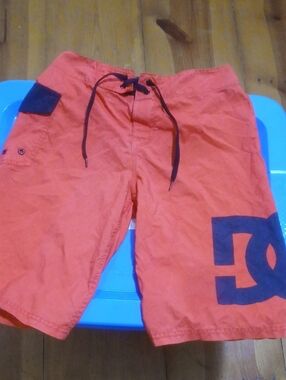DC Men’s Orange Board Shorts with Black Logo